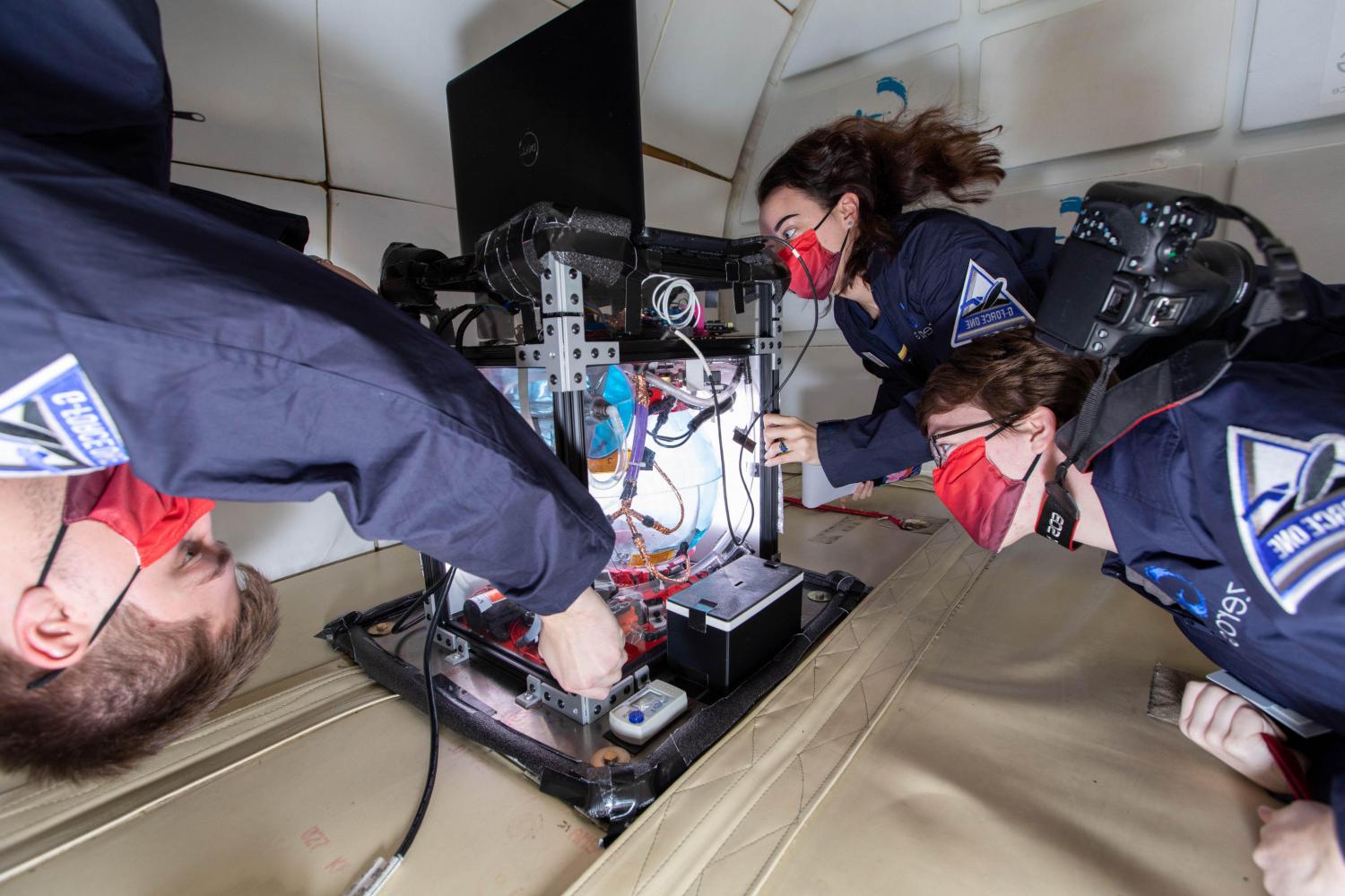 Members of the Carthage College Microgravity Team conduct research aboard NASA?s zero g aircraft.